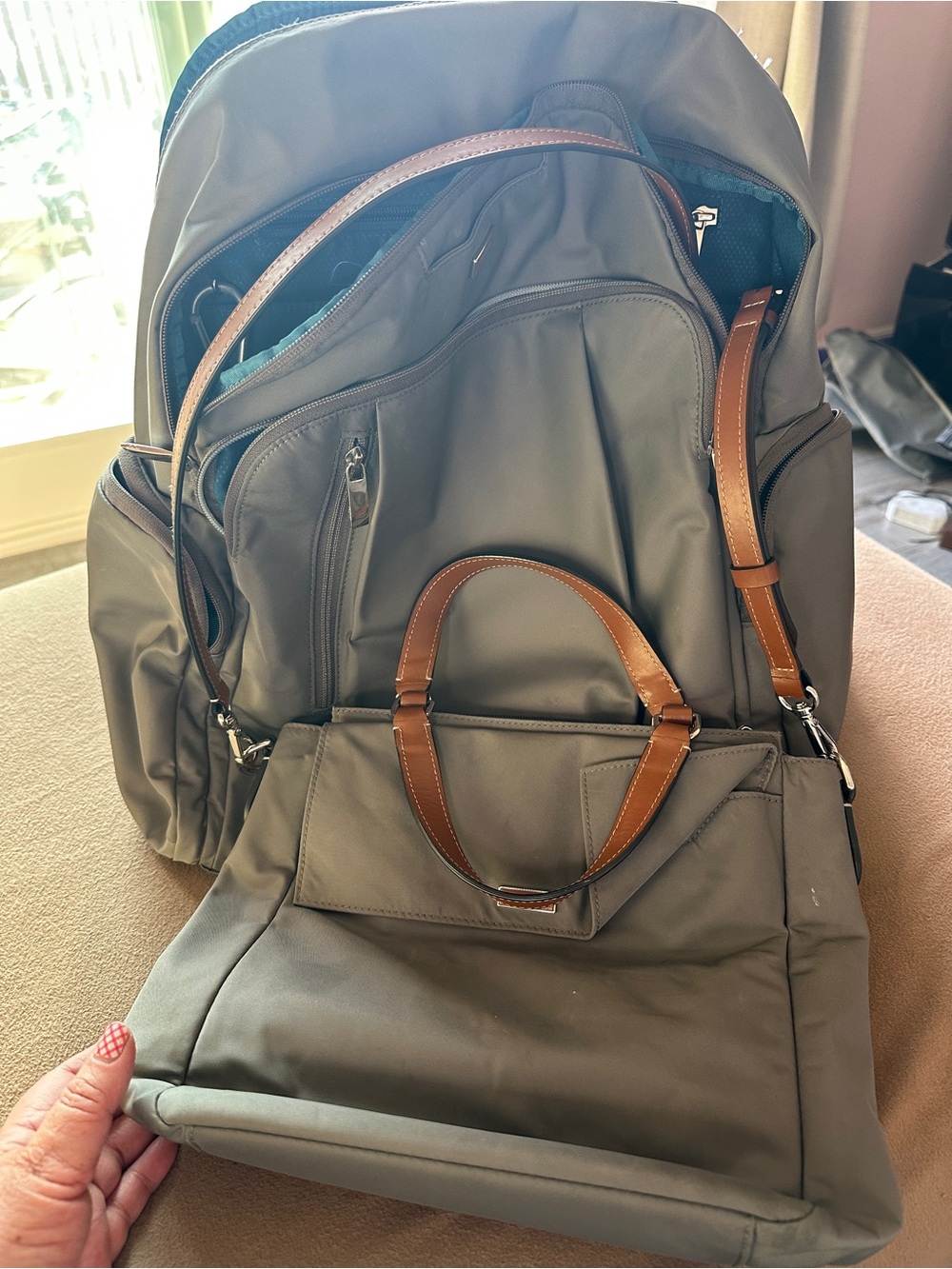 Tumi backpack with crossbody purse.